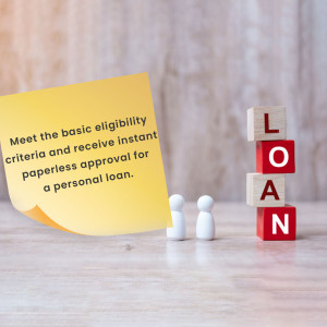 Wooden blocks spelling LOAN with a sticky note about instant approval