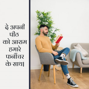 A man sitting in a chair reading a book in a modern living room.