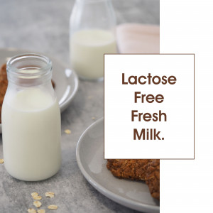 Glass of lactose-free milk with cookies
