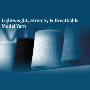 Close-up of white modal yarn spools, highlighting its texture and quality.