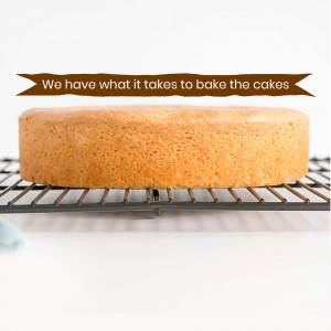 A golden sponge cake cooling on a wire rack with text overlay 'We have what it takes to bake the cakes'