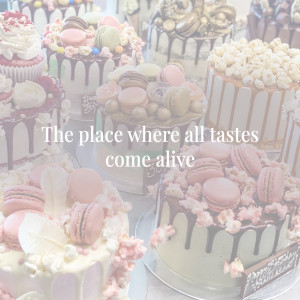 A close-up of a variety of beautifully decorated cakes and macarons.