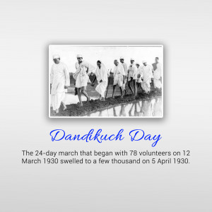 Black and white image of Mahatma Gandhi leading the Dandi March with volunteers.