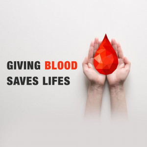 Hands holding a polygonal red blood drop with text 'Giving Blood Saves Lives'