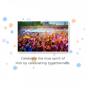 A vibrant crowd celebrating Holi with colored powders.