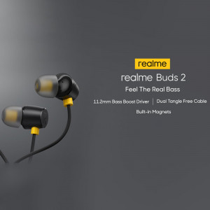 Close-up of black and yellow Realme Buds 2 earphones against a dark grey background.