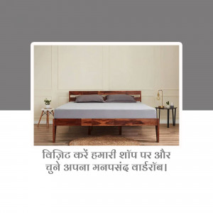 A wooden bed frame with a grey mattress and bedding in a minimalist bedroom setting.