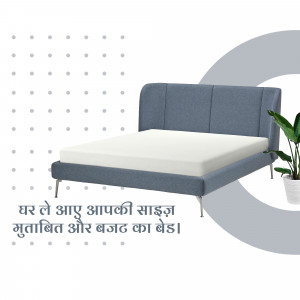 Blue upholstered bed with white mattress and plant