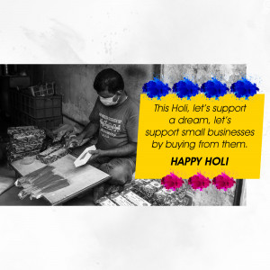 A man wearing a mask working on products with a Holi themed graphic promoting support for small businesses.
