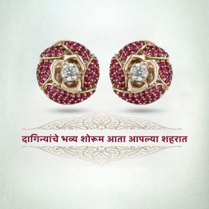 Pair of gold earrings with red stones and a central diamond