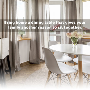 Modern dining room with a round white table and grey chairs