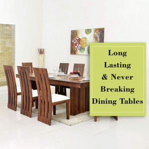 A well-lit dining room featuring a long wooden dining table and chairs, with artwork on the wall.