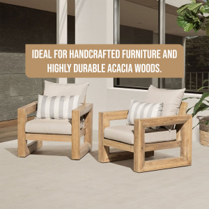 Two acacia wood armchairs with beige cushions on a patio