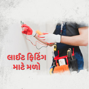 Electrician using a tester on a white wall with electrical wiring