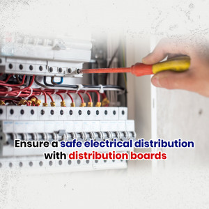Electrician using a screwdriver on an electrical distribution board