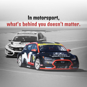 Hyundai race car speeding on a track with motivational text.