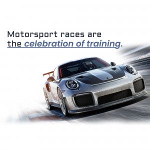 Silver Porsche 911 racing car speeding on a track