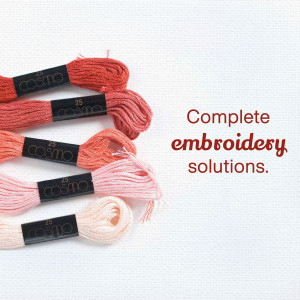 Close-up of Cosmo embroidery floss in various shades of pink and orange