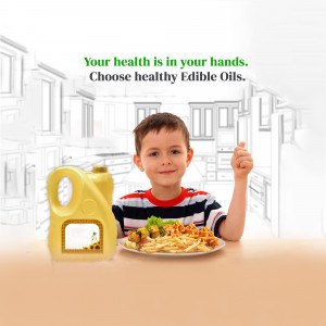 A young boy with a bottle of edible oil and a plate of food.