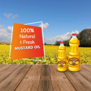Bottles of mustard oil on a wooden surface with a field of mustard flowers in the background