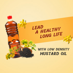 Bottle of mustard oil with mustard flowers and seeds