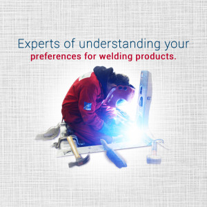 Welder working on a metal structure with welding tools around.