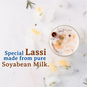 A glass of lassi made from soyabean milk with spices and ice cubes.