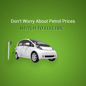 White electric car charging at a station with text promoting switching to electric to avoid petrol prices.