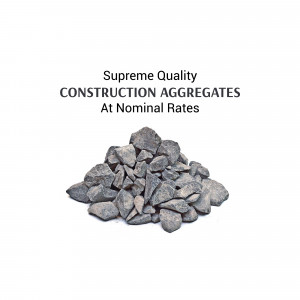 Pile of gray construction aggregates with text 'Supreme Quality CONSTRUCTION AGGREGATES At Nominal Rates'