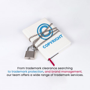 A notebook with 'COPYRIGHT' written on it, secured with a chain and padlock, symbolizing intellectual property protection.