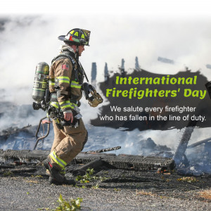 A firefighter walking through a smoky, burnt landscape with text honoring International Firefighters' Day.