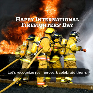 Firefighters battling a blaze on International Firefighters' Day