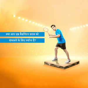 A man in blue sportswear playing badminton on a platform with a spotlight.