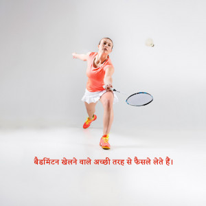 A female badminton player hitting a shuttlecock during a match.