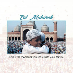 A young boy in a traditional cap being hugged in front of a mosque during Eid celebrations.
