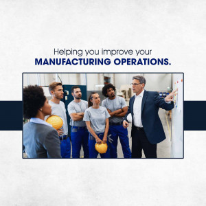 Team of manufacturing professionals discussing strategies on a whiteboard.