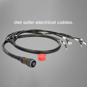 Close-up of black electrical cables with connectors and a red safety cap.