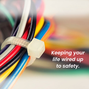 Close-up of colorful cables neatly organized with a white zip tie