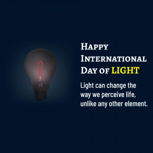 Image celebrating International Day of Light with a lightbulb and red ribbon.