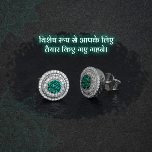 Close-up of sparkling emerald and diamond earrings on a dark background.