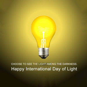 A glowing light bulb against a gradient background with text celebrating International Day of Light.