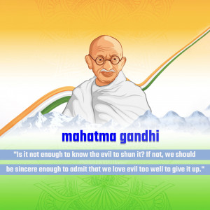 Portrait of Mahatma Gandhi with the Indian flag and a motivational quote.