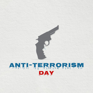 Silhouette of a gun forming a face with the text 'Anti-Terrorism Day'
