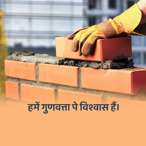 A worker's hand in a yellow glove placing a brick on a wall under construction.