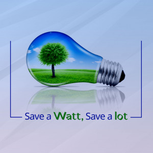 Light bulb containing a tree and green landscape, representing energy conservation.