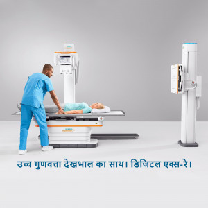 A healthcare professional operating a digital X-ray machine with a patient lying on the table.
