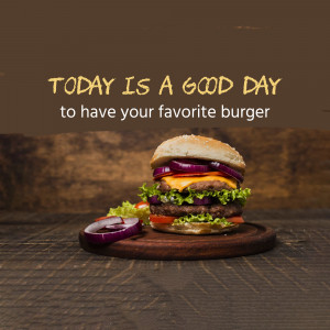 Close-up of a juicy burger with fresh ingredients on a wooden surface.