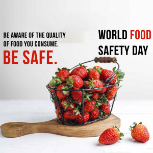 A basket of fresh strawberries with text promoting World Food Safety Day.