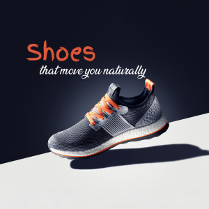 Close-up of grey and orange Adidas running shoes with the tagline 'Shoes that move you naturally'