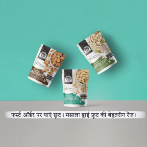 Three pouches of flavored almonds, cashews, and pistachios against a teal background.